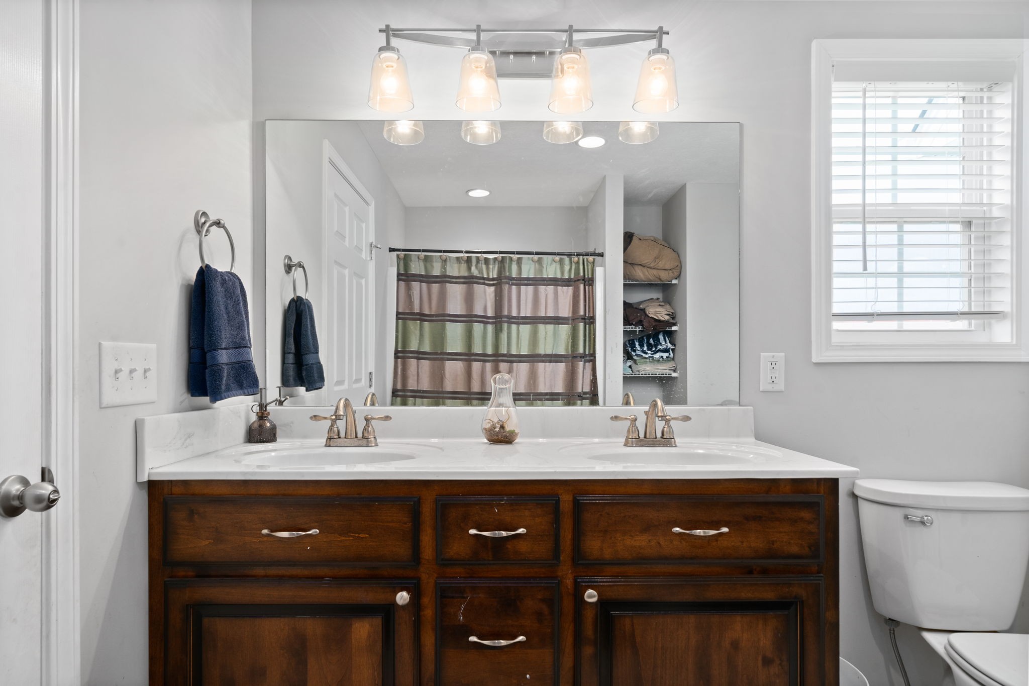 209 Northup Road Portland, TN 37148 - Photo 17 of 39 a bathroom with a sink double vanity and a mirror