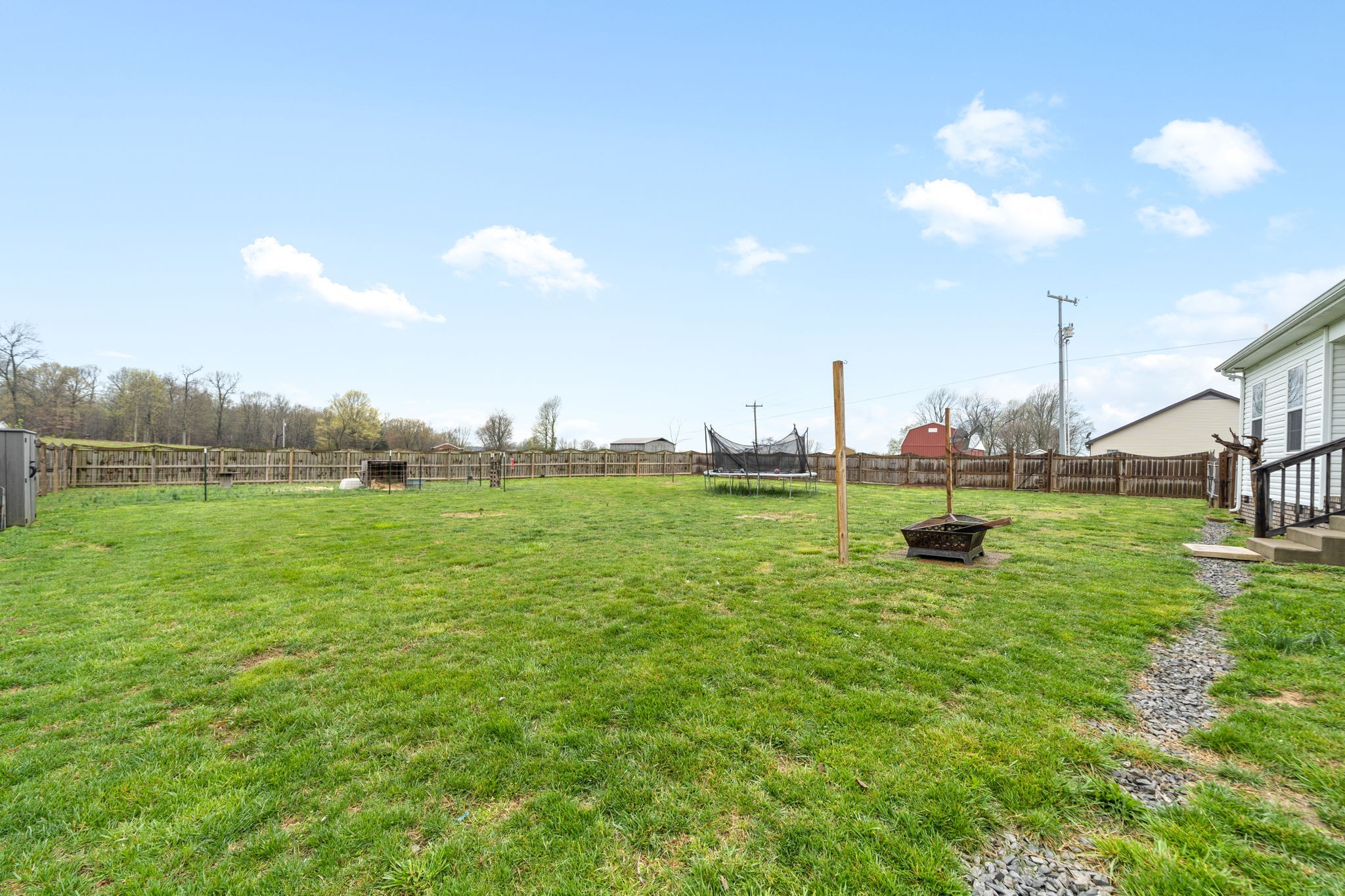 209 Northup Road Portland, TN 37148 - Photo 33 of 39 a view of a golf course with a lake