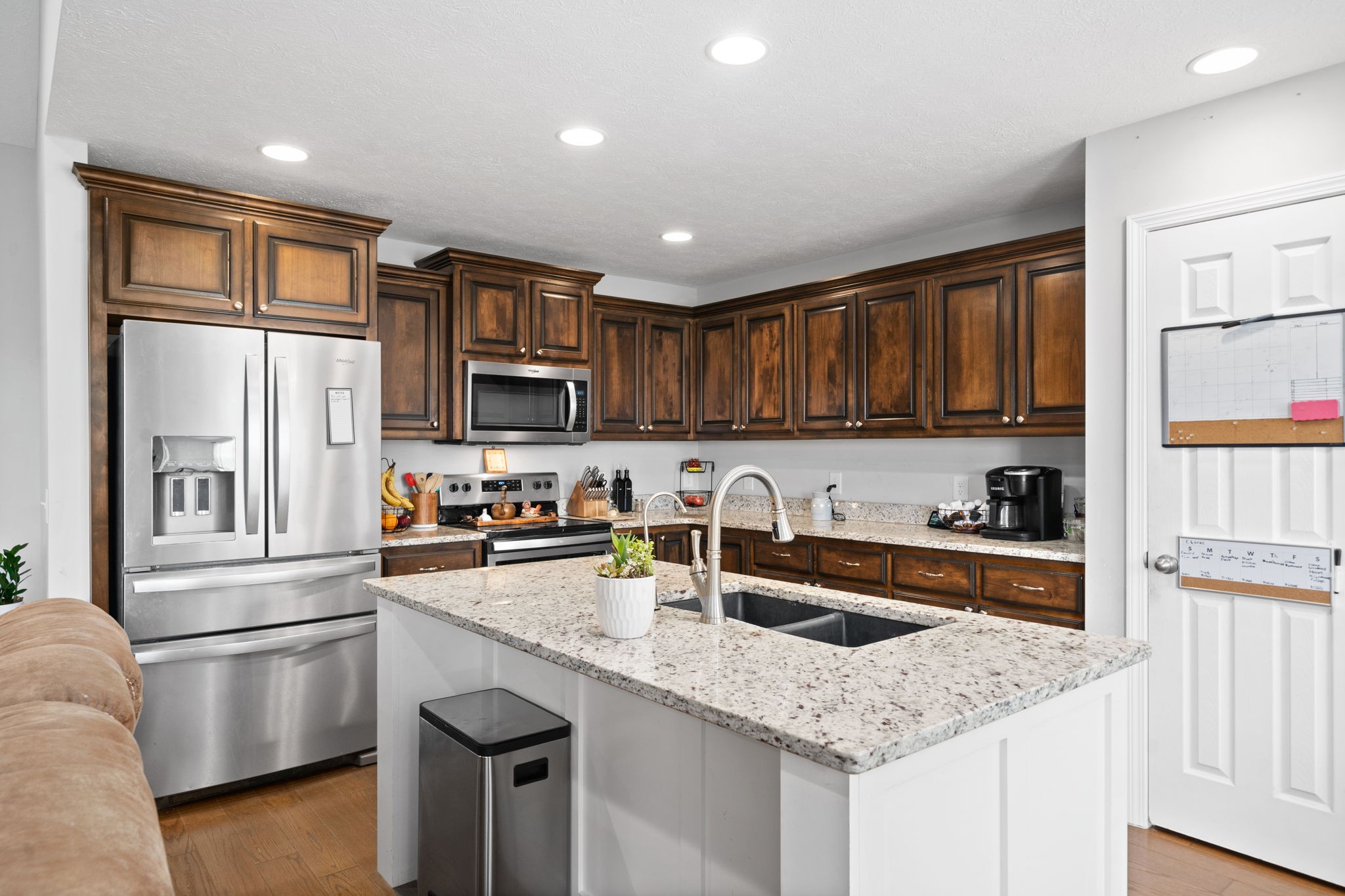 209 Northup Road Portland, TN 37148 - Photo 8 of 39 a kitchen with stainless steel appliances granite countertop a sink dishwasher stove and refrigerator