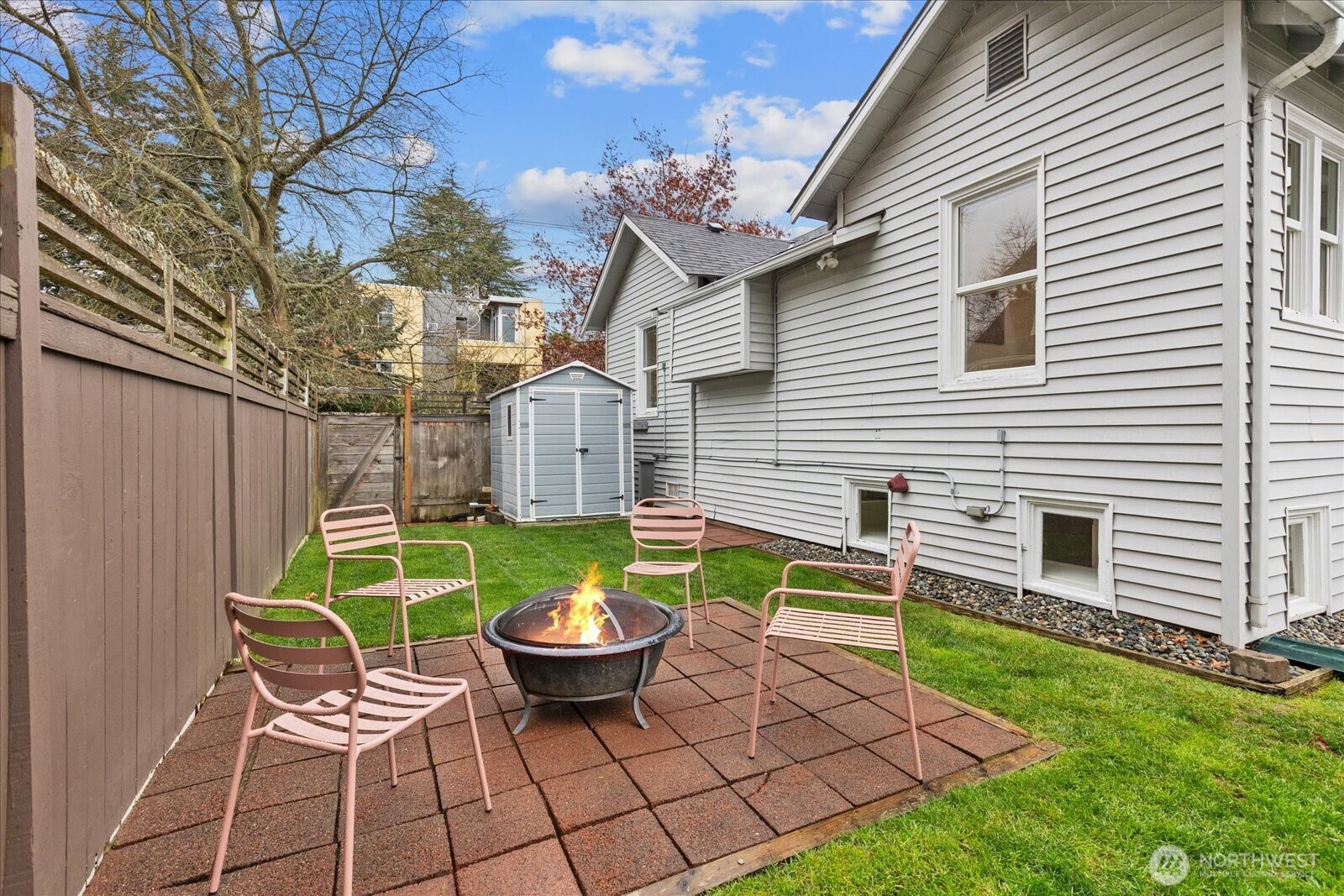 2857 Northwest 73rd Street Seattle, WA 98117 - Photo 17 of 25 a chairs and a table in backyard of the house