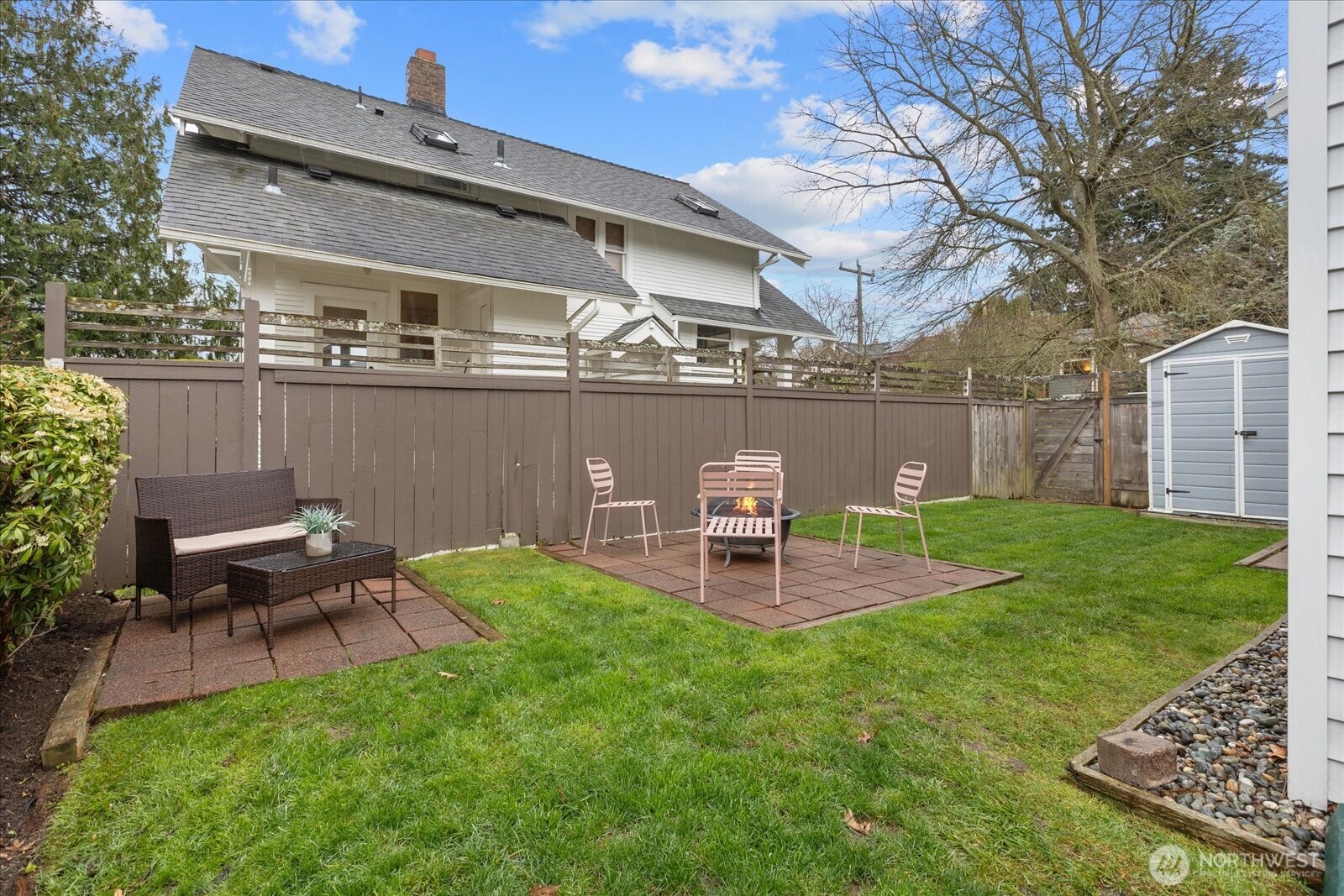 2857 Northwest 73rd Street Seattle, WA 98117 - Photo 18 of 25 a table and chairs sitting in the garden