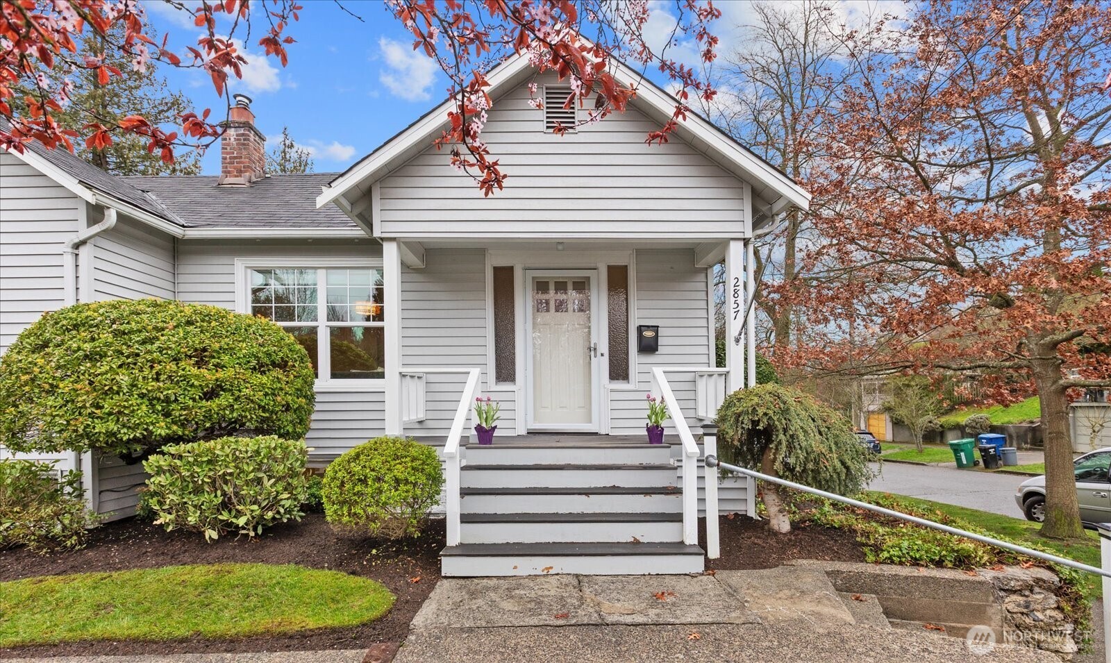 2857 Northwest 73rd Street Seattle, WA 98117 - Photo 2 of 25 a front view of a house with a garden
