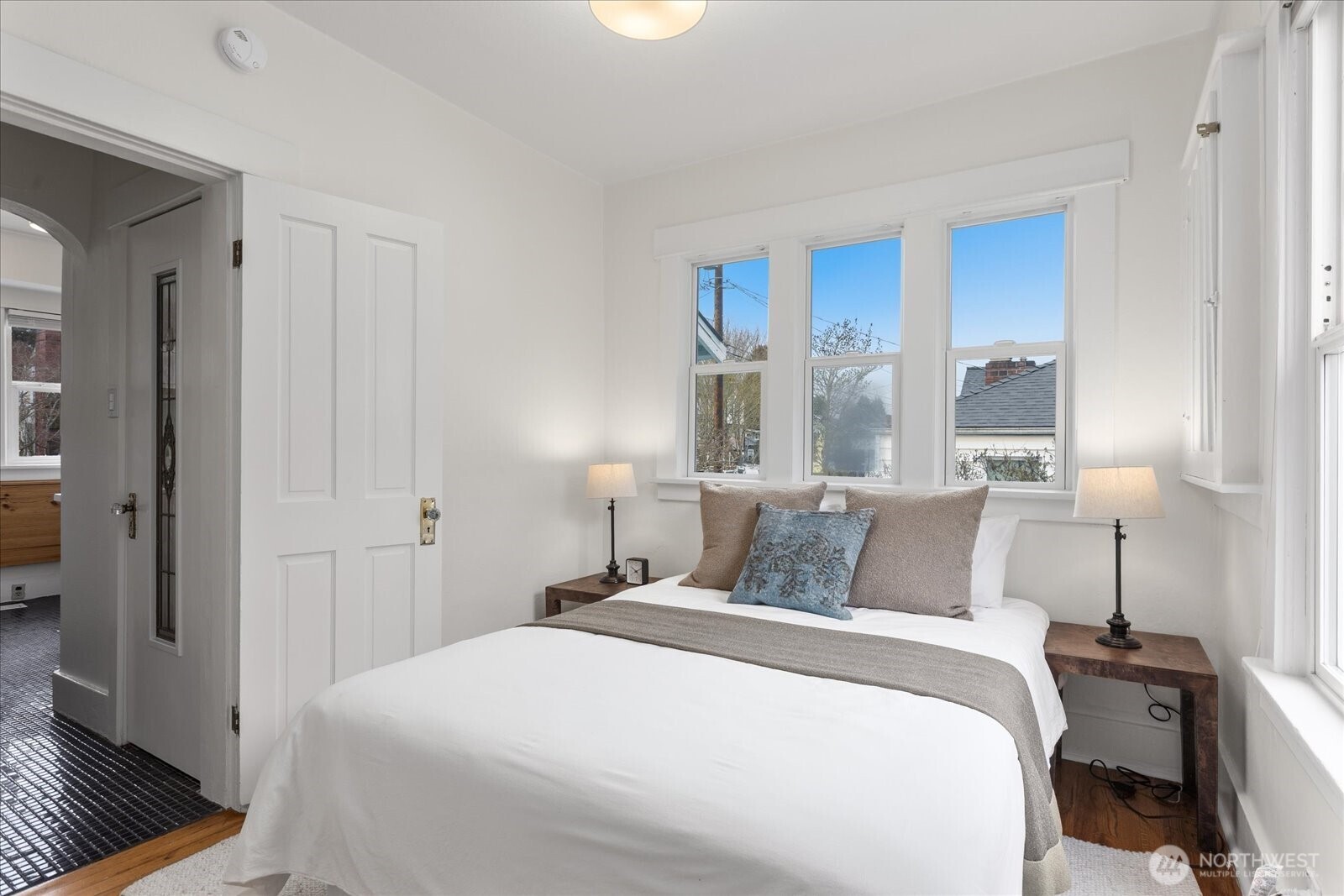 2857 Northwest 73rd Street Seattle, WA 98117 - Photo 7 of 25 a bedroom with a bed and a window