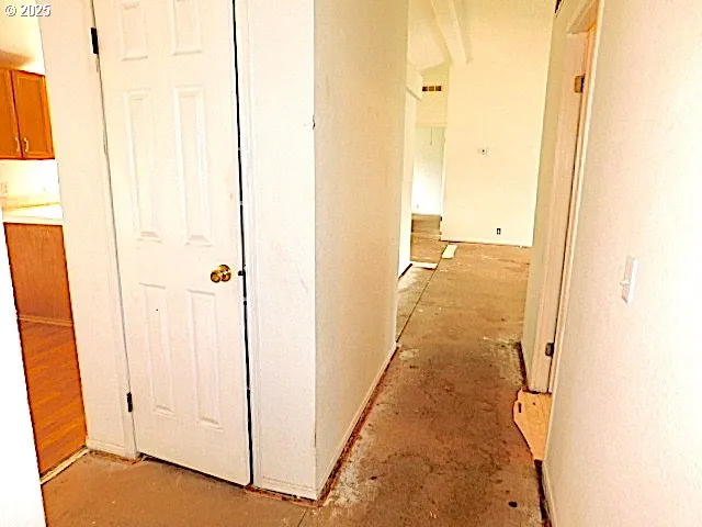 a kitchen with stainless steel appliances granite countertop a sink dishwasher stove and cabinets with wooden floor