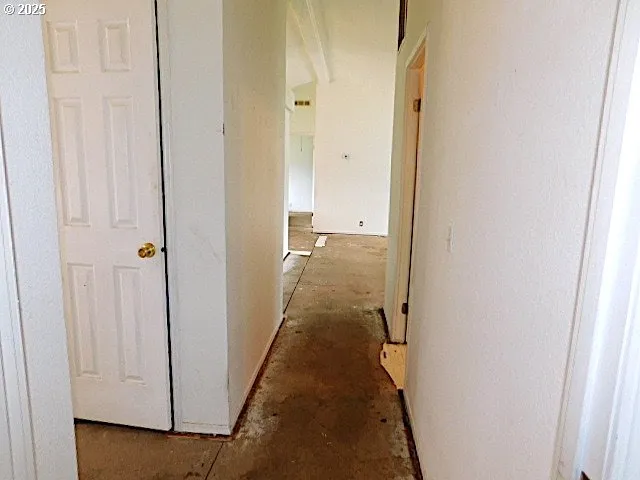 a kitchen with stainless steel appliances a refrigerator and a stove top oven