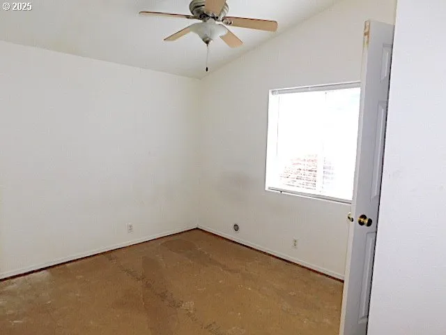 a view of a hallway with wooden floor and closet