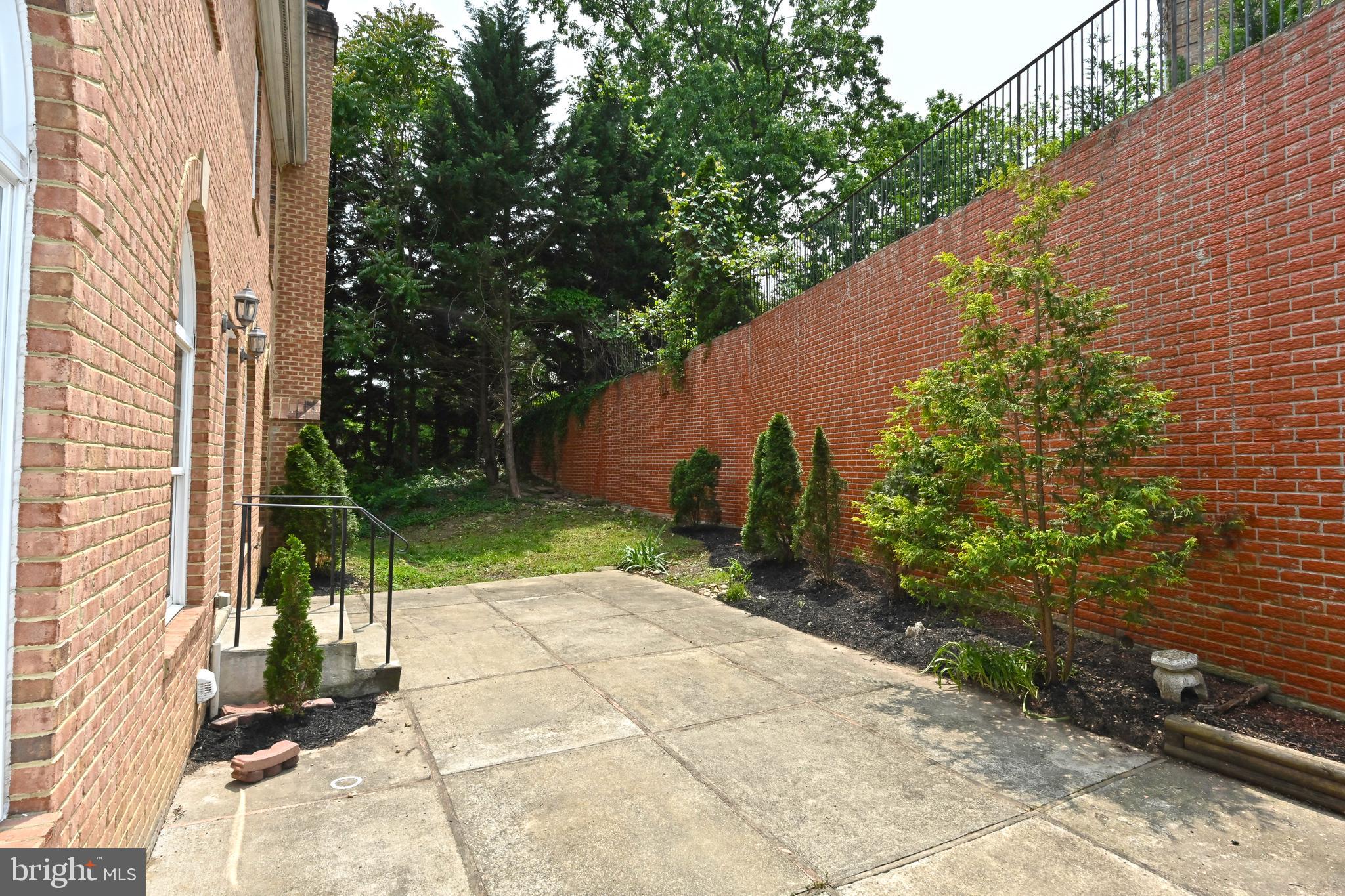 5218 Clinton Road Alexandria, VA 22312 - Photo 86 of 106 extended lot beyond retaining wall