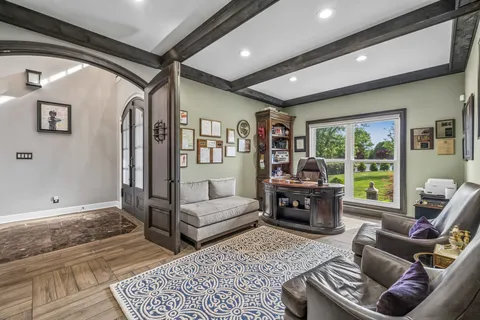 a spacious bedroom with a bed and a large mirror