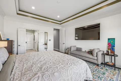 a living room with furniture fireplace and rug floor