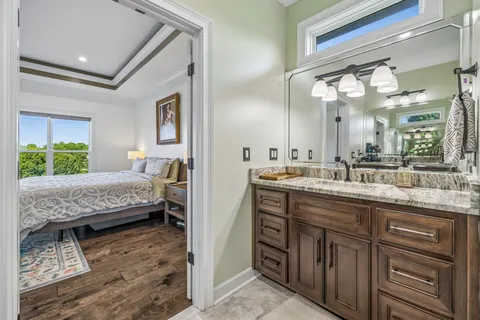 a bedroom with a bed and a table in it
