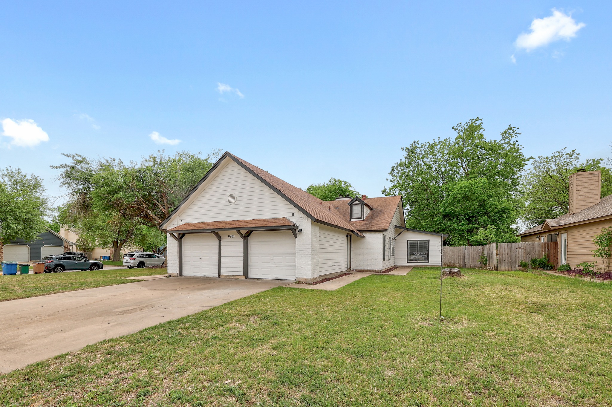 9901 Parliament House Road Austin, TX 78729 - Photo 1 of 40 View of front of house featuring driveway and an attached garage