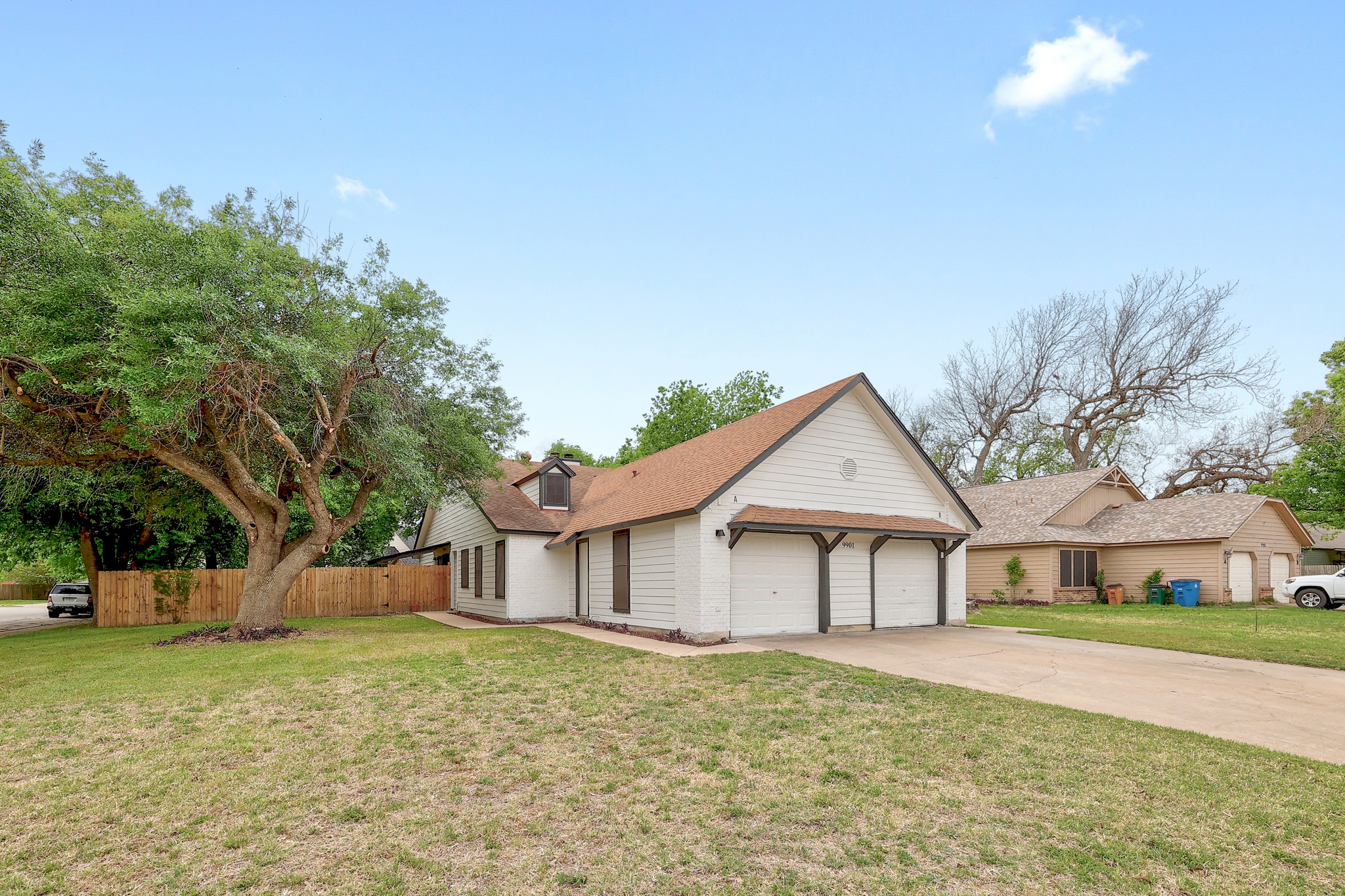 9901 Parliament House Road Austin, TX 78729 - Photo 2 of 40 Single story home featuring concrete driveway and an attached garage