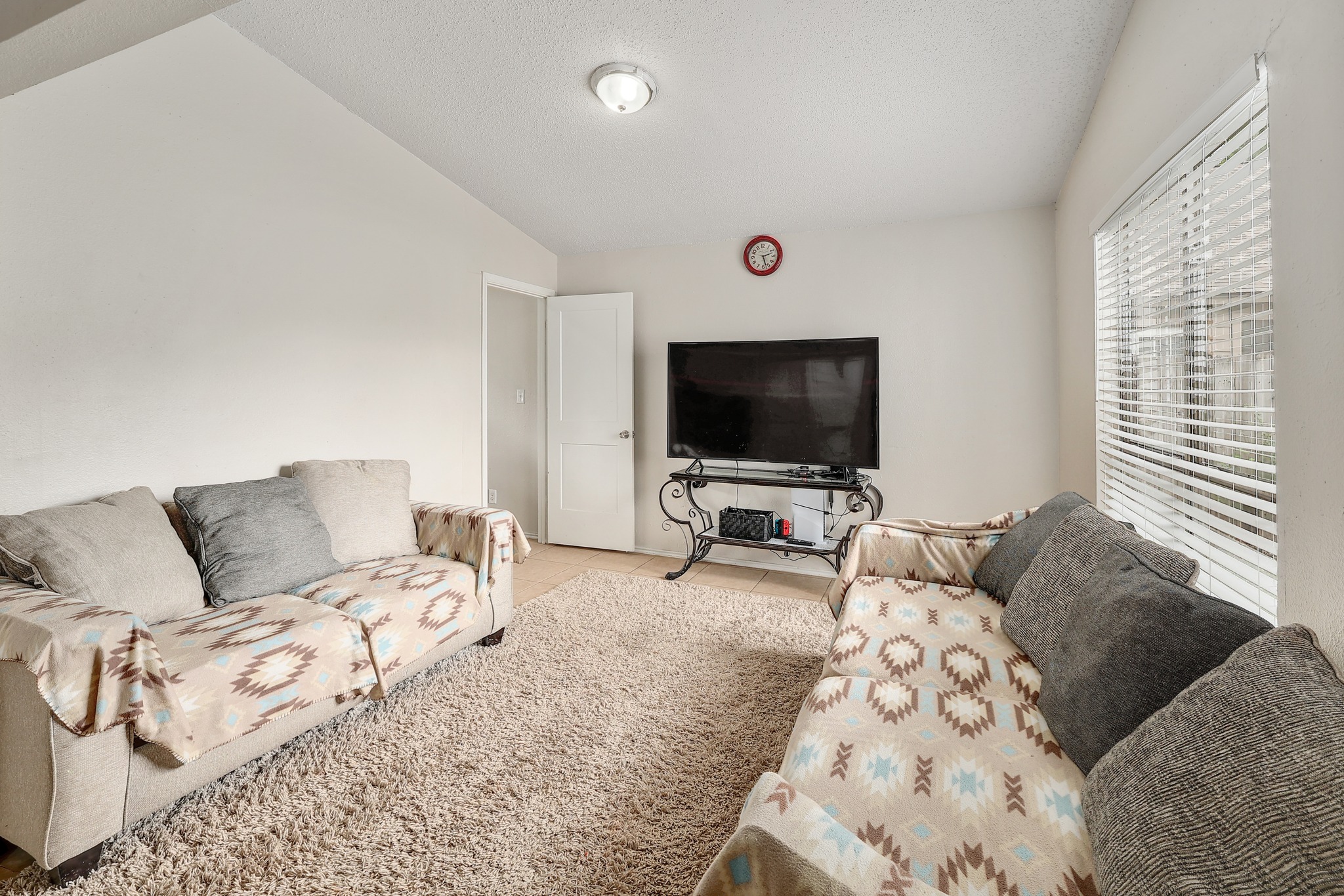 9901 Parliament House Road Austin, TX 78729 - Photo 25 of 40 Living room featuring light tile patterned floors