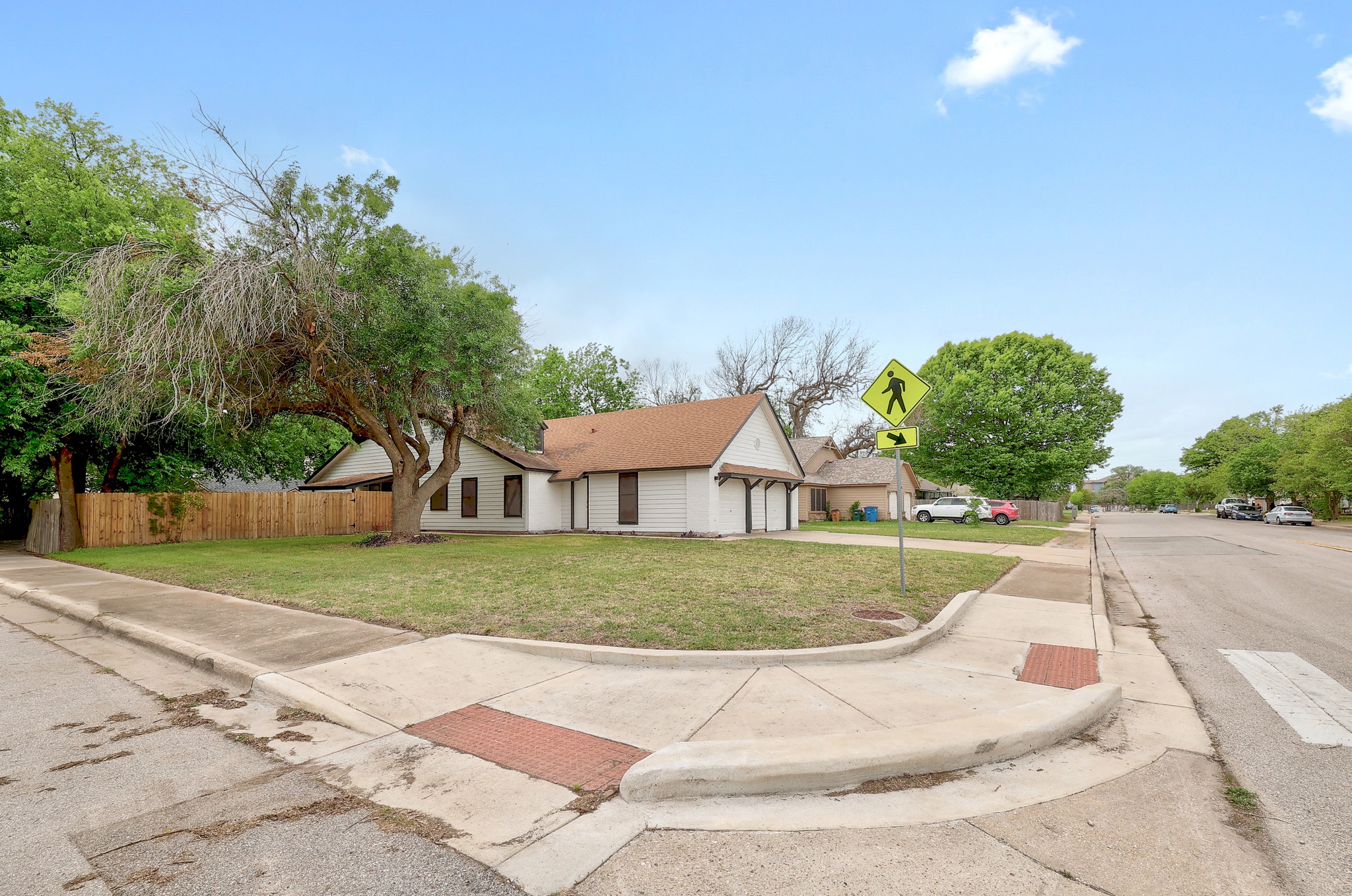9901 Parliament House Road Austin, TX 78729 - Photo 3 of 40 View of front of home with a garage
