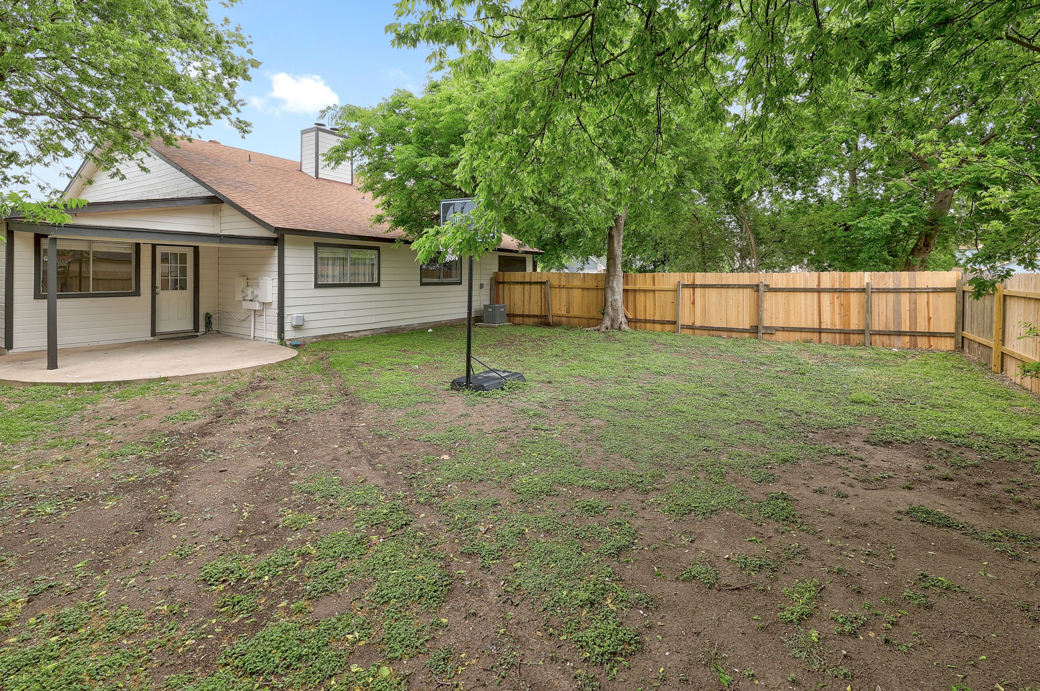 9901 Parliament House Road Austin, TX 78729 - Photo 35 of 40 Fenced backyard with a patio area