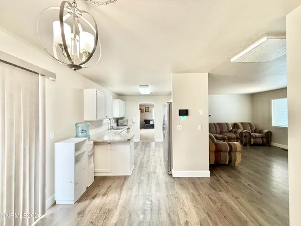 a view of a living room and a wooden floor