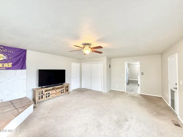 a view of livingroom with furniture and a flat screen tv