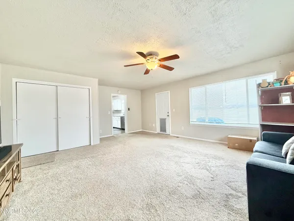 a view of livingroom with hardwood floor and a ceiling fan