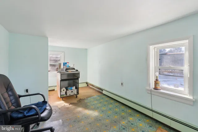 a room with furniture and a window