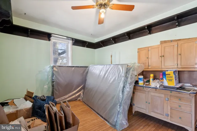 a kitchen with a refrigerator and cabinets