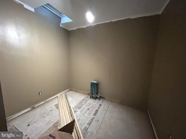 a bathroom with a sink and a window