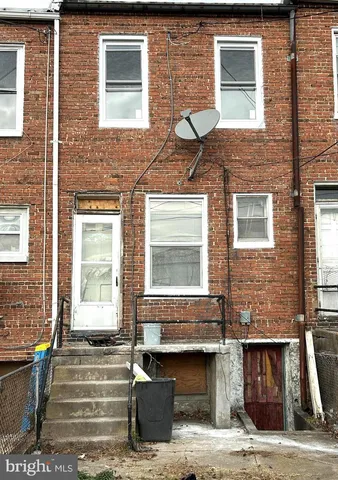 a front view of a house with a many windows