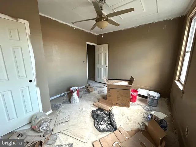 a bed room with a bed and a chandelier