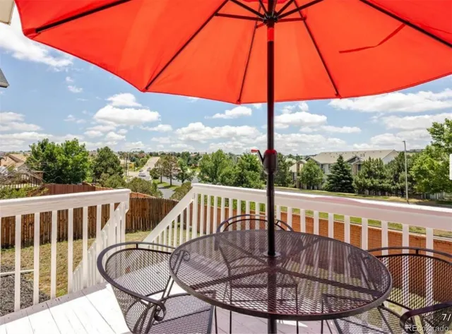 a view of a balcony with furniture