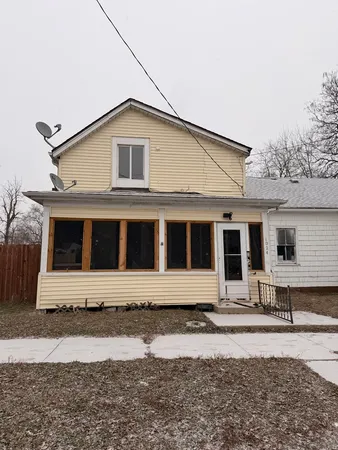 a front view of a house with yard
