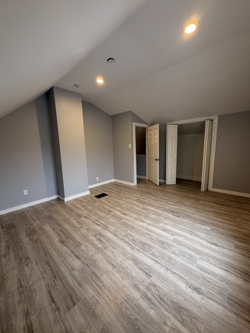1024 South Warren Street Peoria, IL 61605 - Photo 8 of 14 a view of an empty room with wooden floor