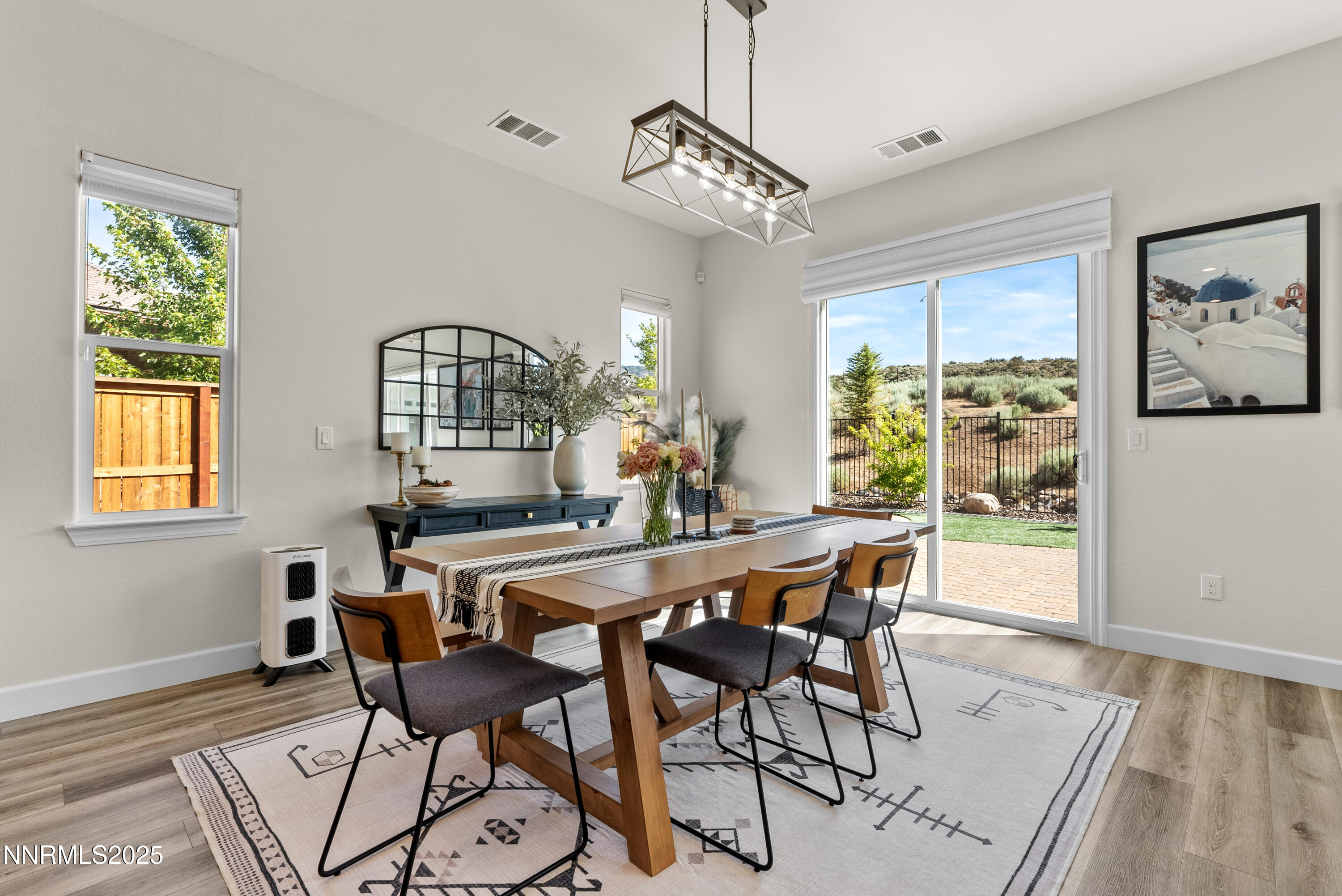 8650 Gasparilla Way Reno, NV 89439 - Photo 12 of 29 a view of a dining room with furniture window and wooden floor