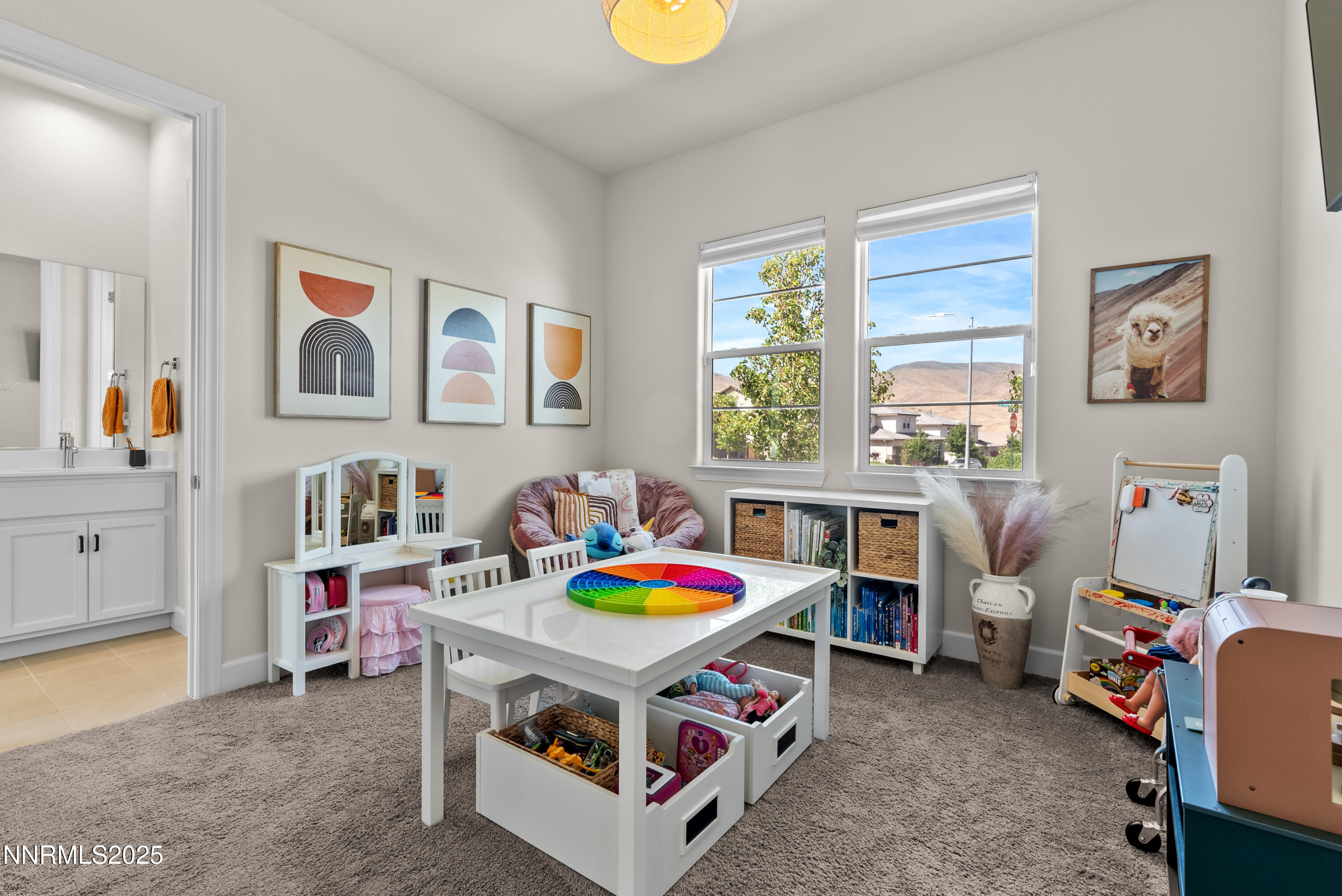 8650 Gasparilla Way Reno, NV 89439 - Photo 18 of 29 a living room with furniture and a baby crib