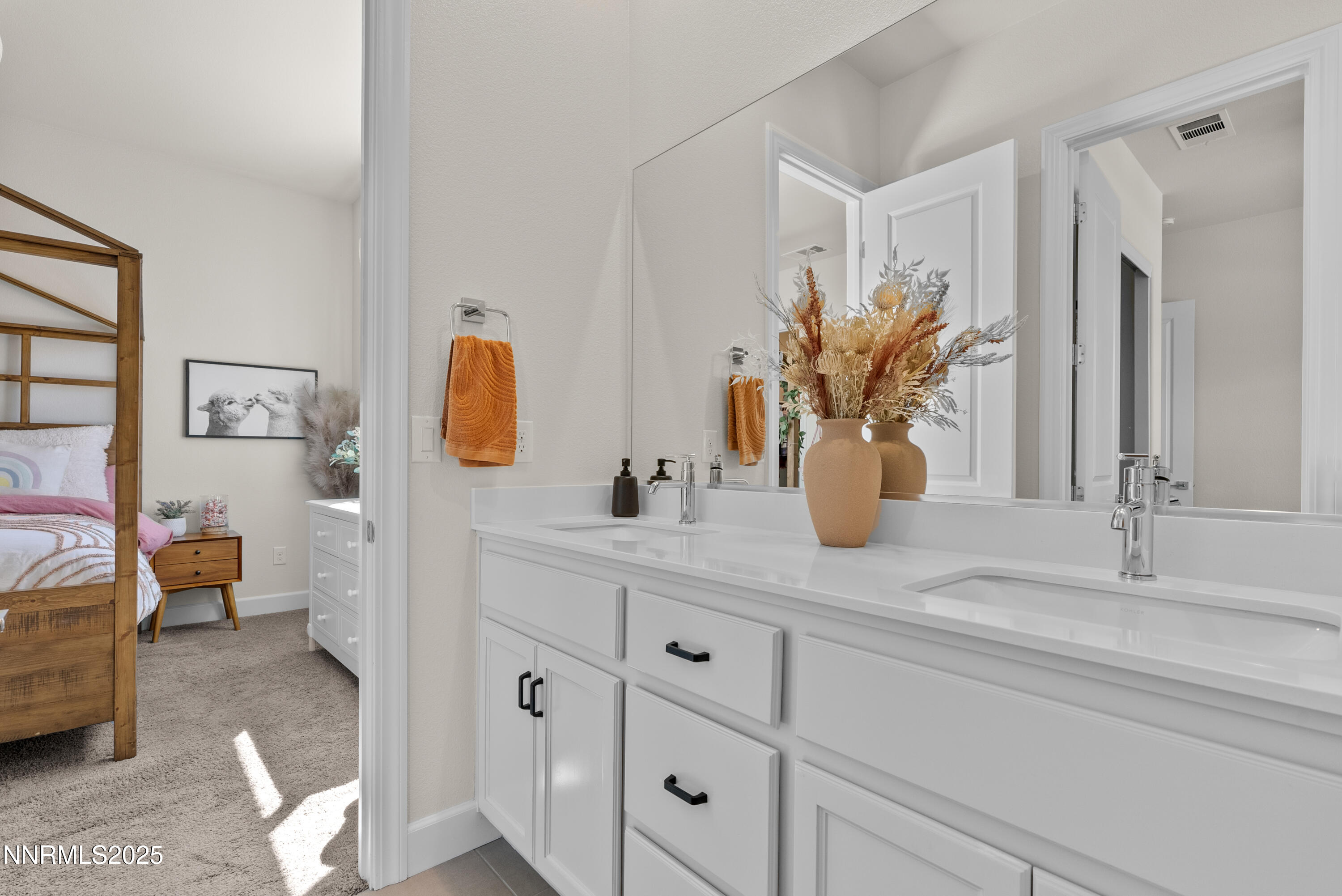 8650 Gasparilla Way Reno, NV 89439 - Photo 20 of 29 a bathroom with a double vanity sink and a mirror