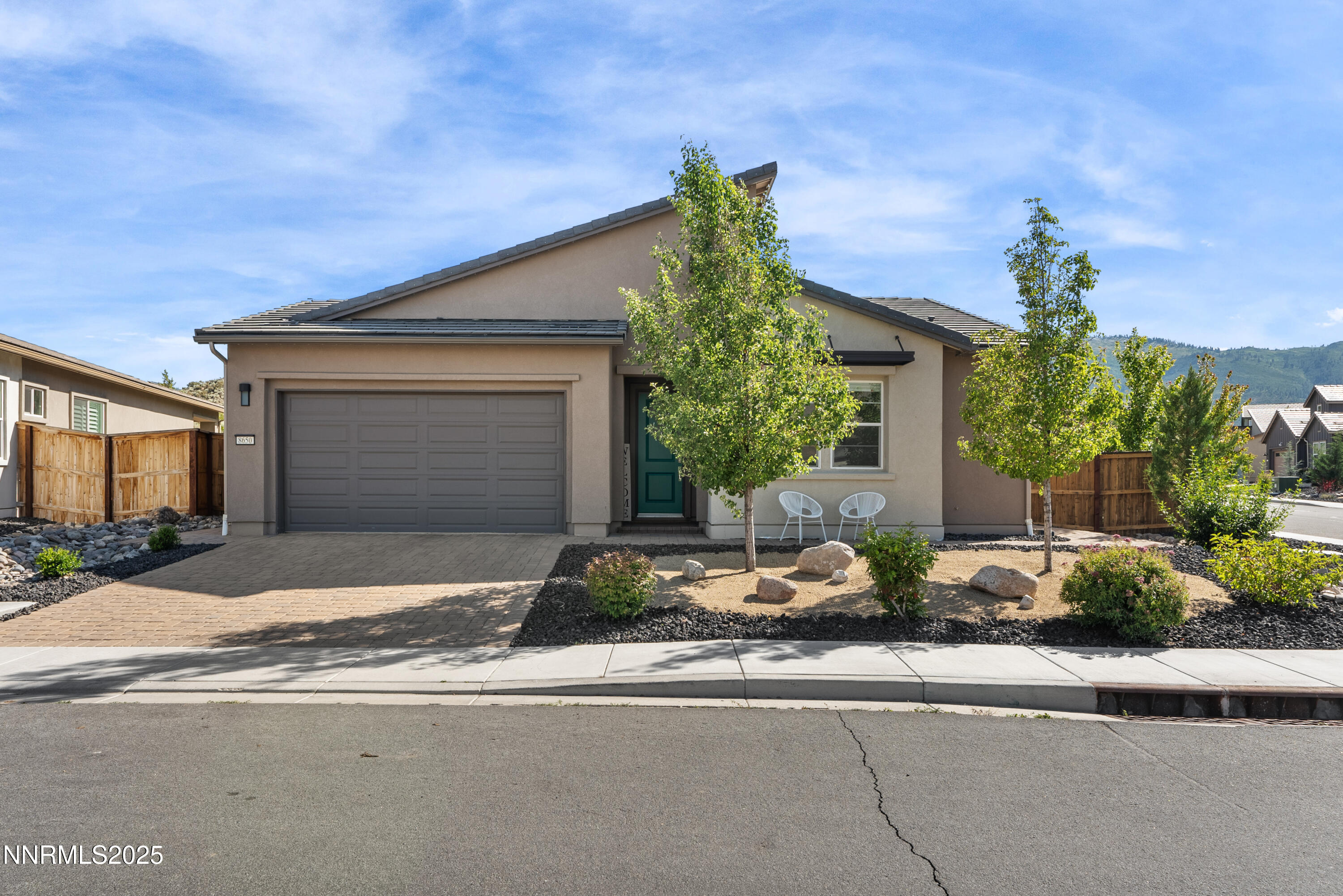 8650 Gasparilla Way Reno, NV 89439 - Photo 29 of 29 a front view of a house with yard garage and outdoor seating