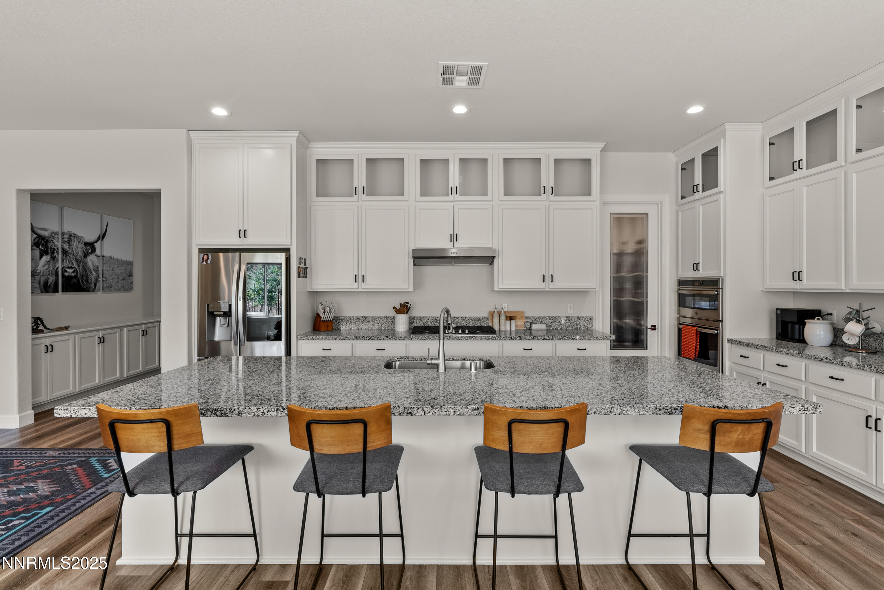 8650 Gasparilla Way Reno, NV 89439 - Photo 5 of 29 a kitchen with stainless steel appliances granite countertop a kitchen island a stove a cabinets a sink and a counter space