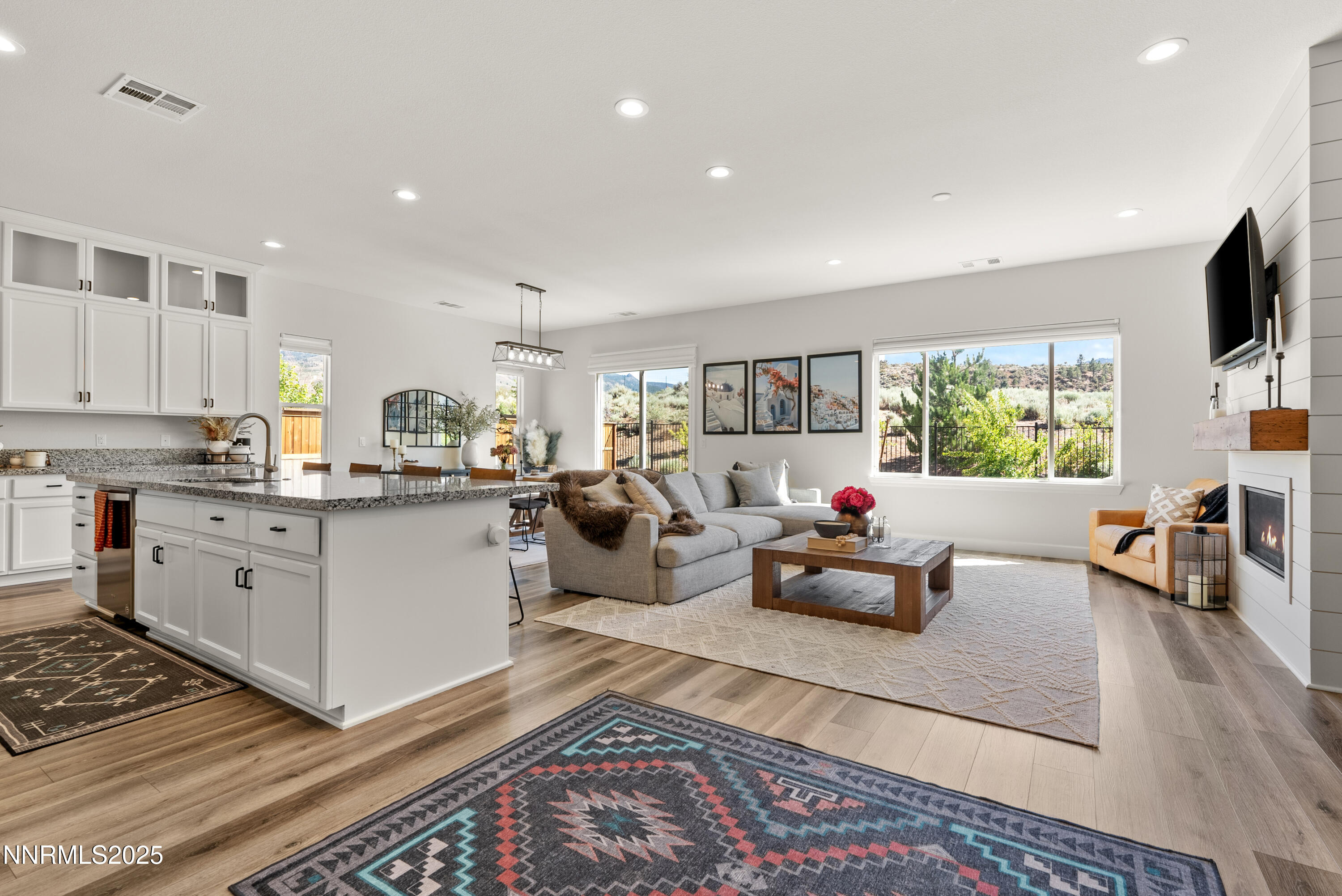 8650 Gasparilla Way Reno, NV 89439 - Photo 6 of 29 a living room with furniture and a flat screen tv with kitchen view