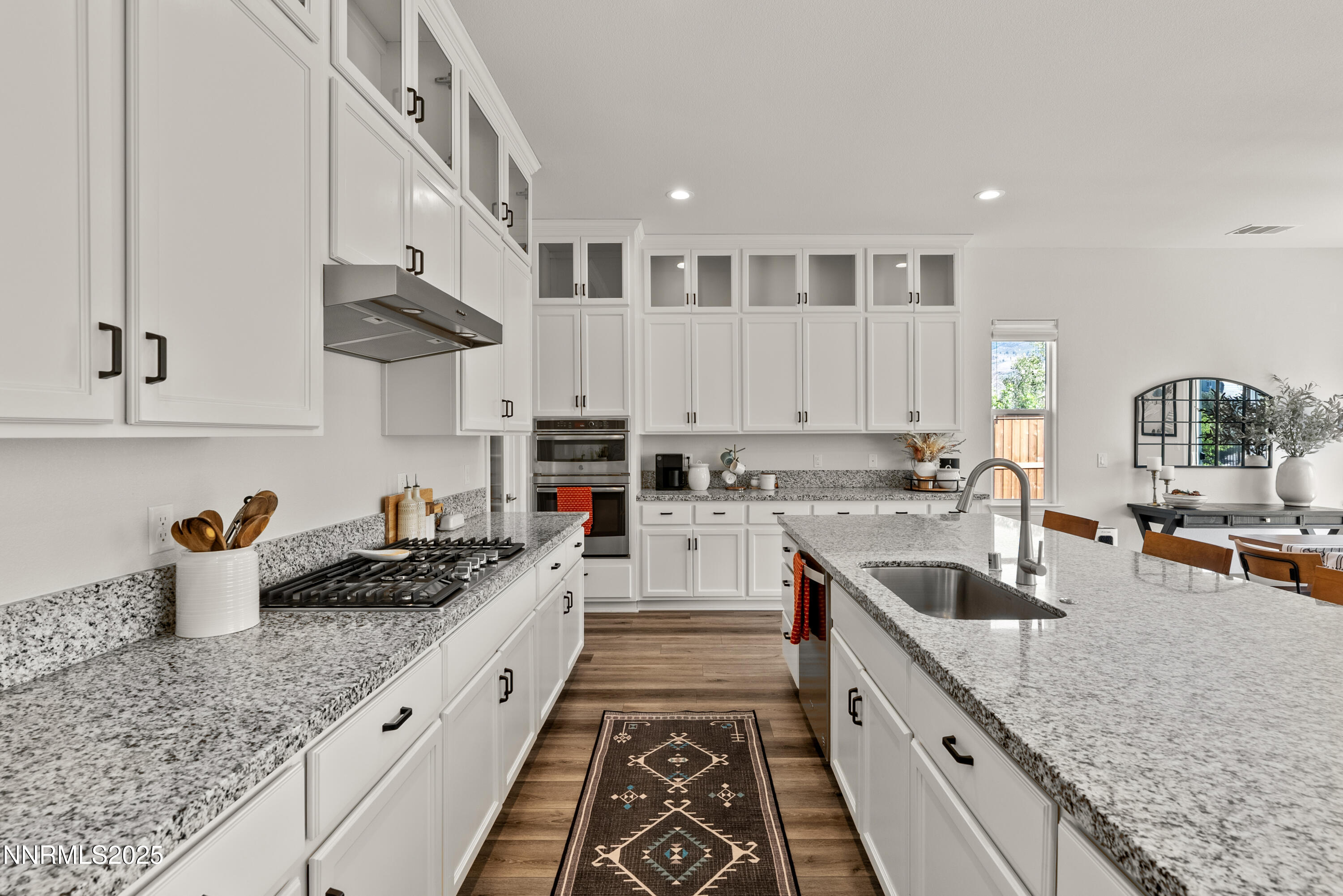 8650 Gasparilla Way Reno, NV 89439 - Photo 9 of 29 a kitchen with stainless steel appliances granite countertop a sink stove and cabinets