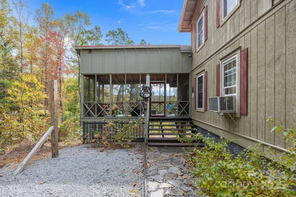 a front view of a house with outdoor seating