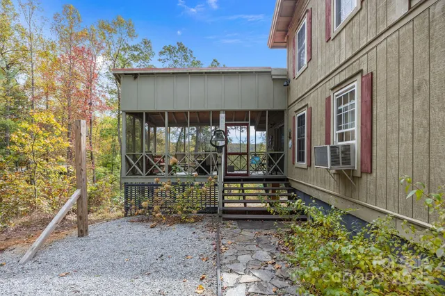 a front view of a house with outdoor seating