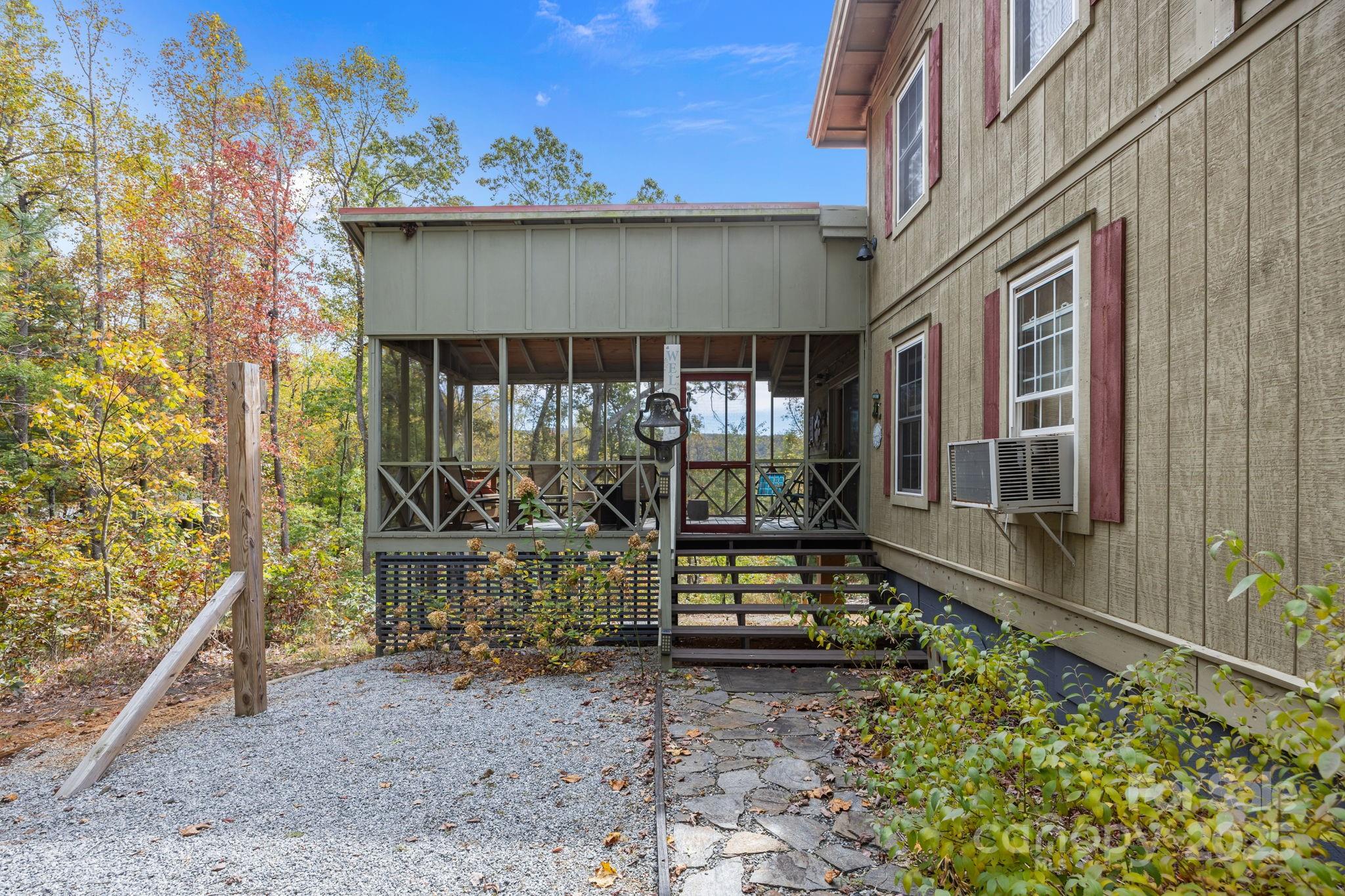 38 Buzzards Rst Trail, Unit 7 Saluda, NC 28773 - Photo 11 of 47 a front view of a house with outdoor seating