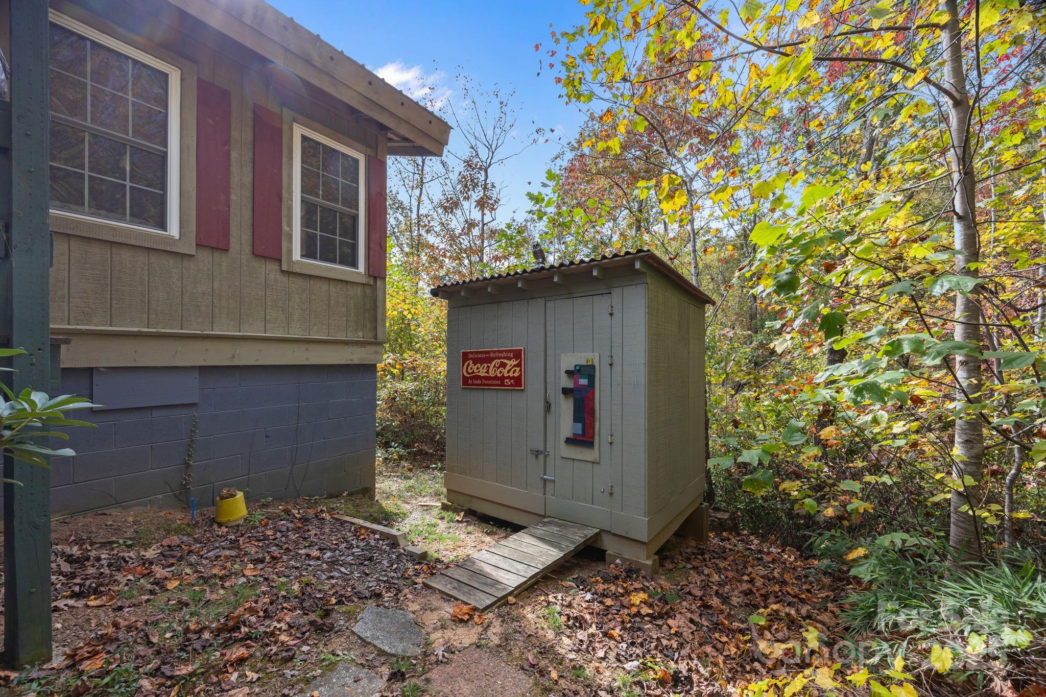 38 Buzzards Rst Trail, Unit 7 Saluda, NC 28773 - Photo 13 of 47 a front view of a house with a tree