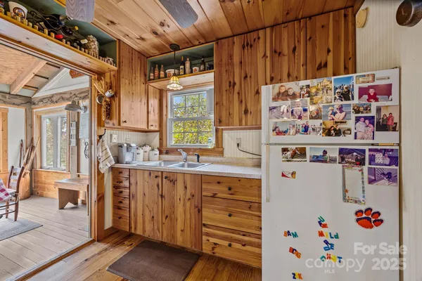 a open kitchen with stainless steel appliances granite countertop a stove and a refrigerator