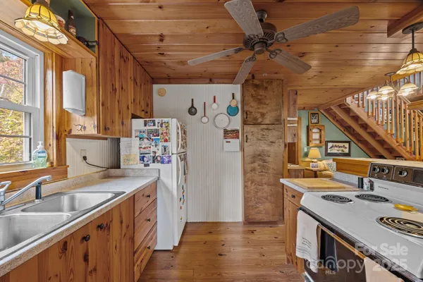 a kitchen with stainless steel appliances granite countertop a stove and a sink