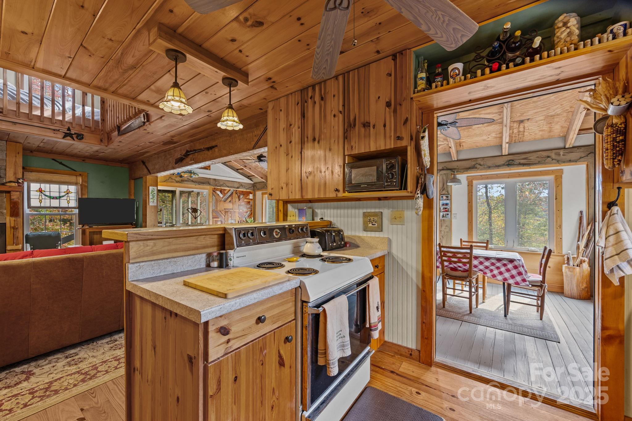 38 Buzzards Rst Trail, Unit 7 Saluda, NC 28773 - Photo 22 of 47 a open kitchen with stainless steel appliances granite countertop a stove and a refrigerator