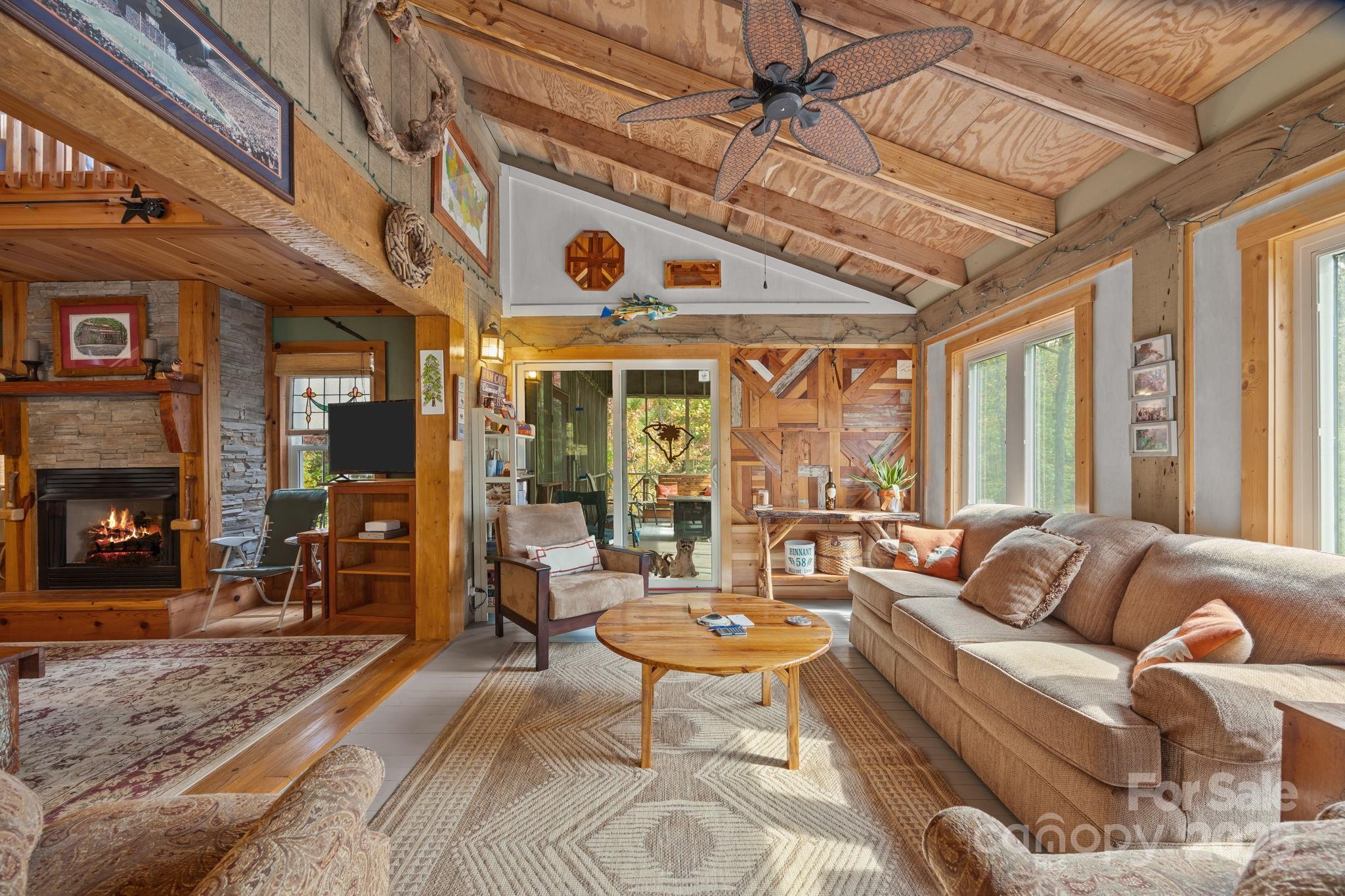 38 Buzzards Rst Trail, Unit 7 Saluda, NC 28773 - Photo 24 of 47 a living room with patio furniture and a large window