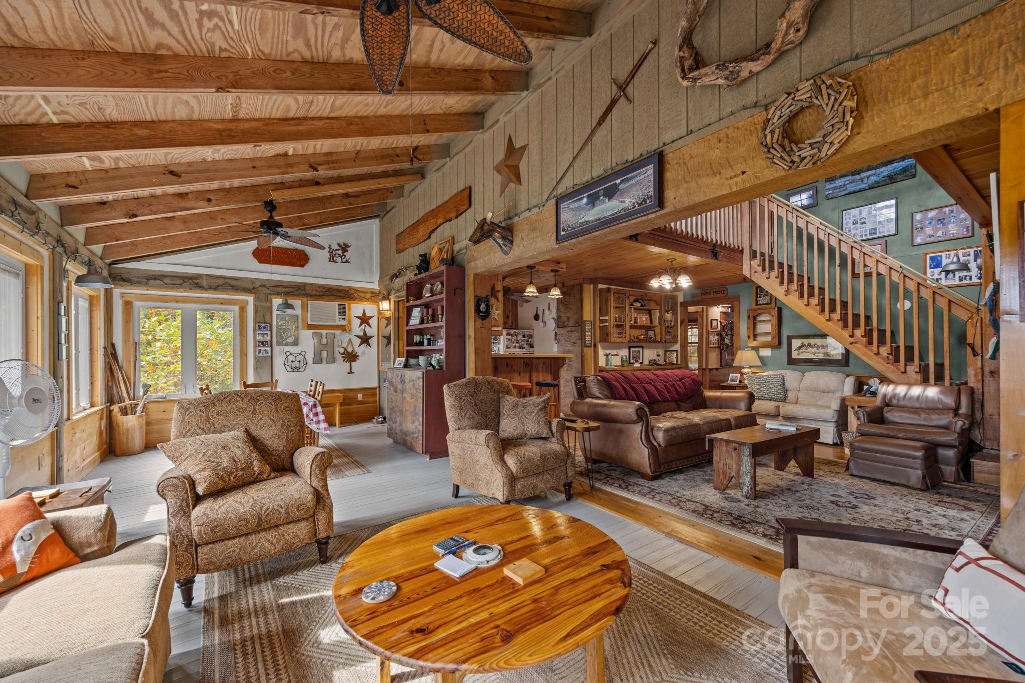 38 Buzzards Rst Trail, Unit 7 Saluda, NC 28773 - Photo 27 of 47 a living room with lots of furniture and a large window
