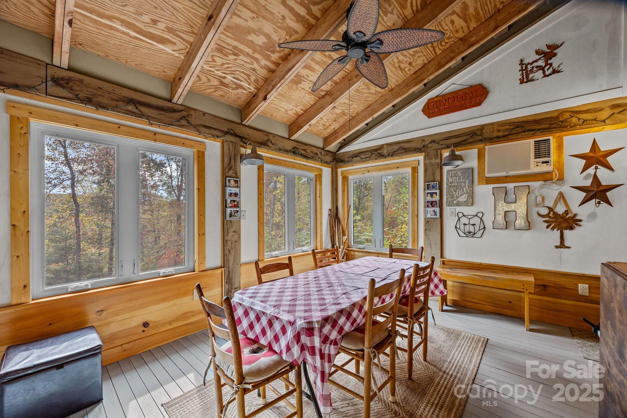 38 Buzzards Rst Trail, Unit 7 Saluda, NC 28773 - Photo 28 of 47 a dining room with furniture and a large window