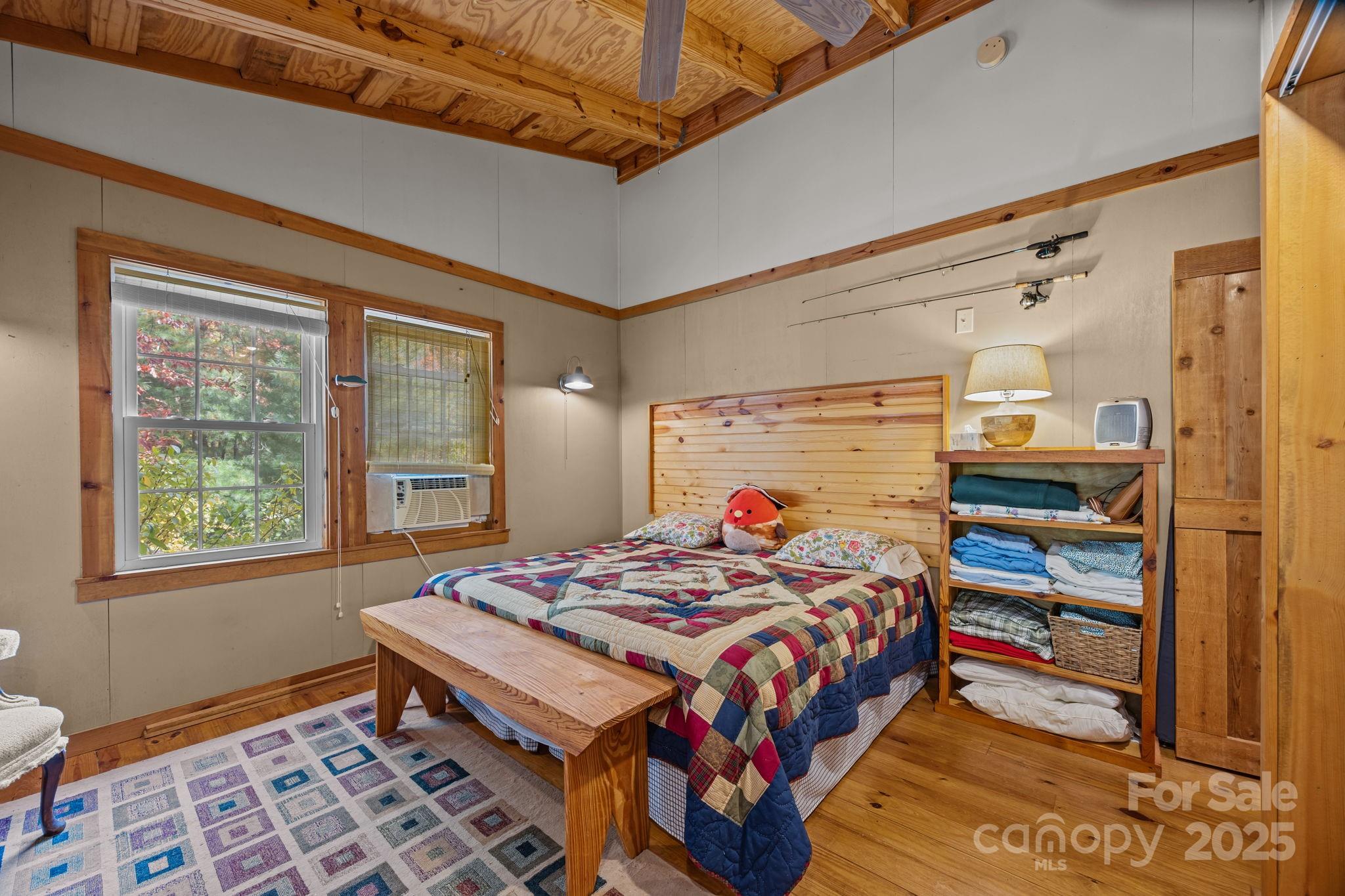 38 Buzzards Rst Trail, Unit 7 Saluda, NC 28773 - Photo 30 of 47 a bedroom with a bed and a window