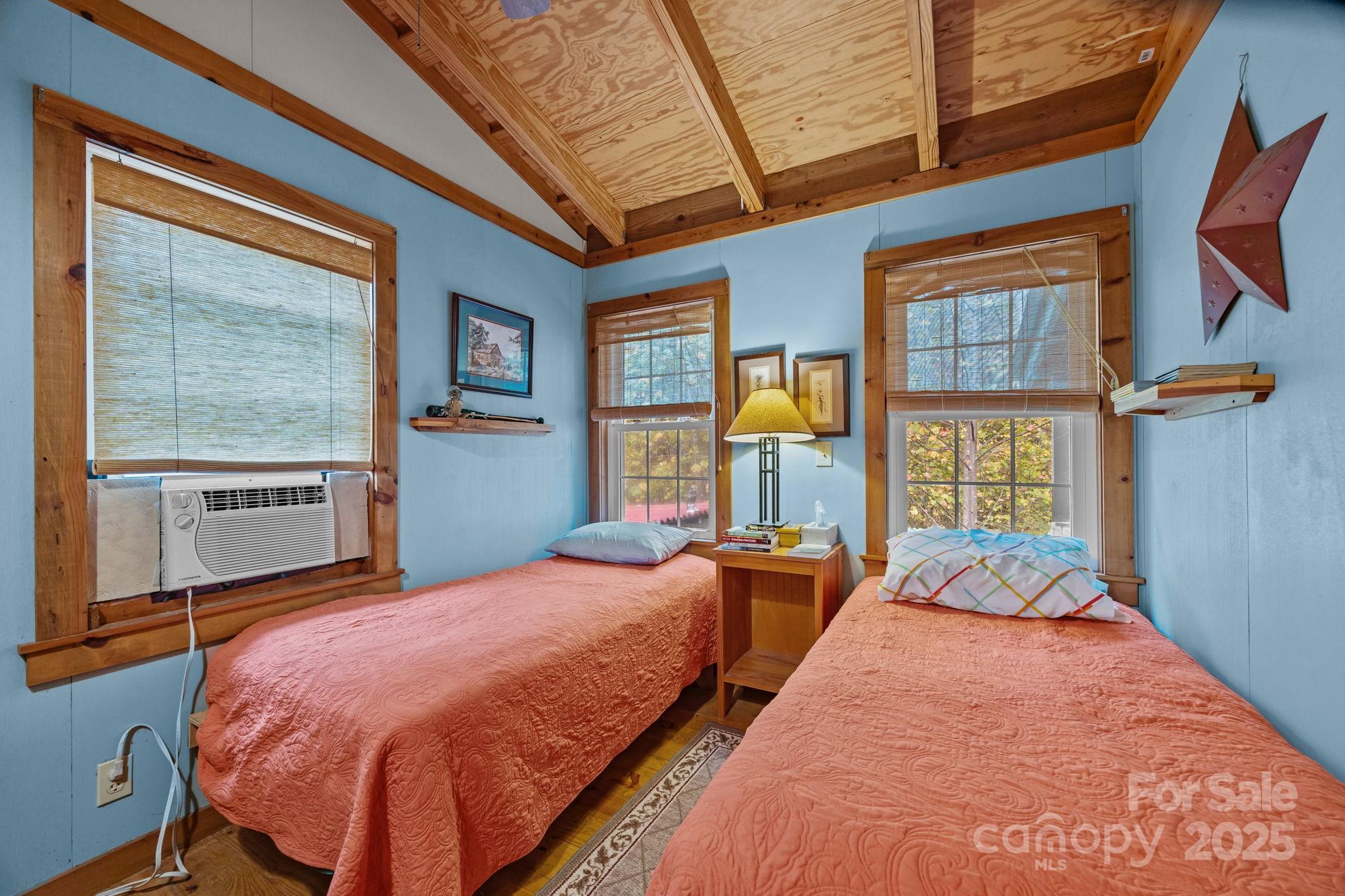 38 Buzzards Rst Trail, Unit 7 Saluda, NC 28773 - Photo 33 of 47 a bedroom with bed and a large window