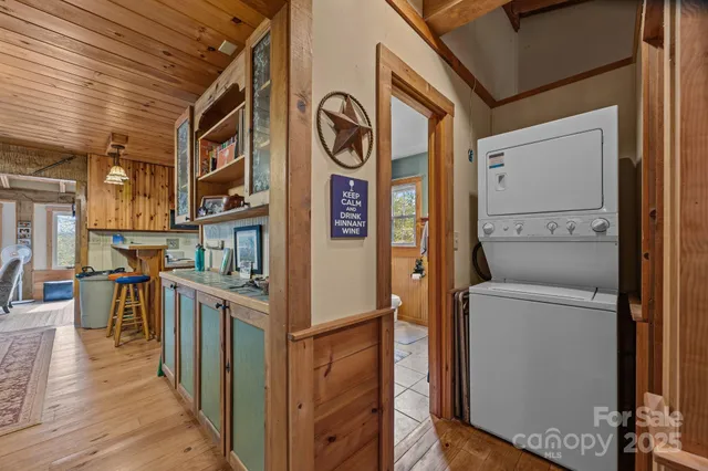 a bedroom with furniture and large windows